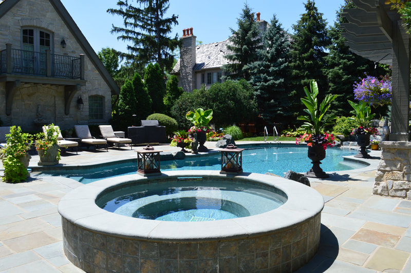 wide shot of hot tub and swimming pool in backyard