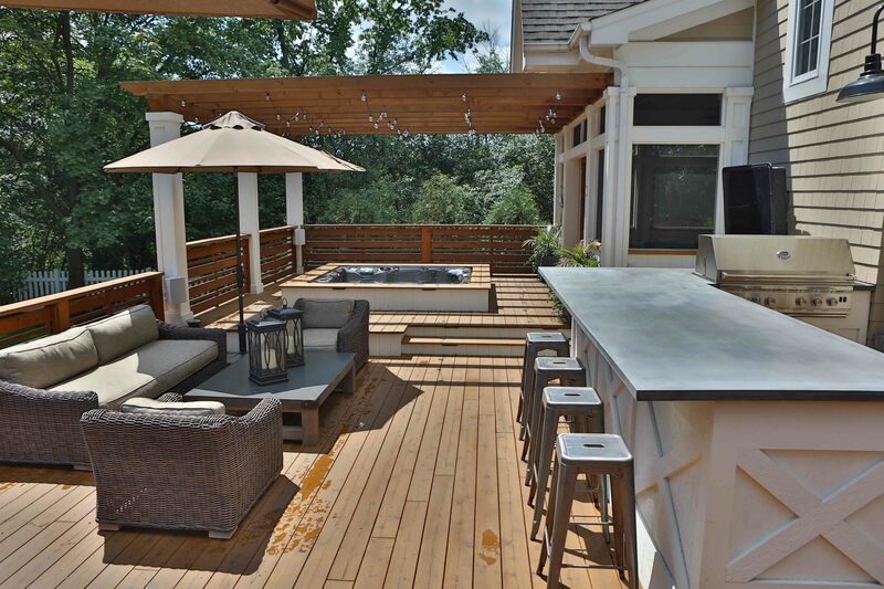 back patio with bar, furniture and hot tub