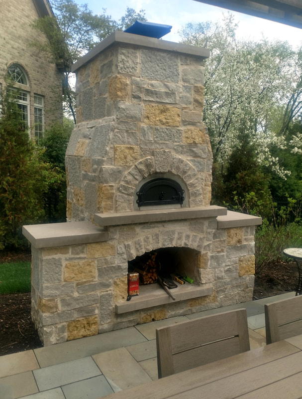 closeup of chimney and fireplace in backyard