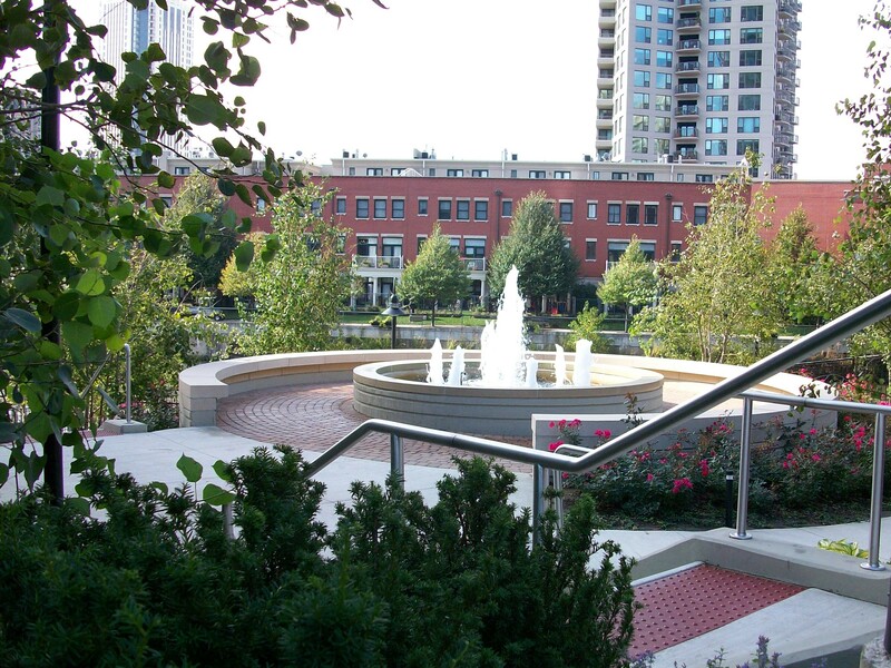 large circular fountain in the middle of a campus