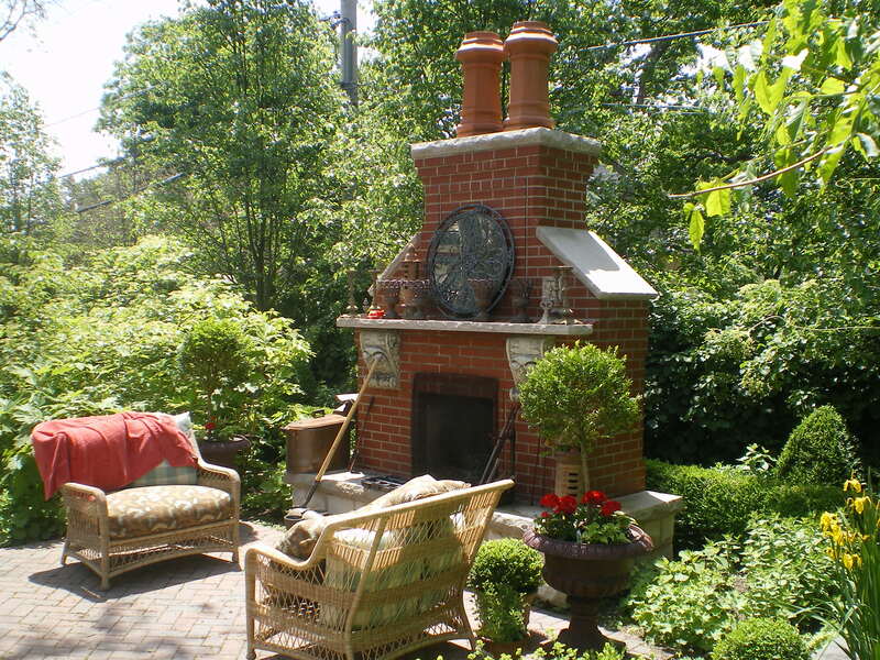 backyard redbrick fireplace and chimney with furniture